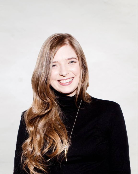 Portrait of Sarah against a light surface